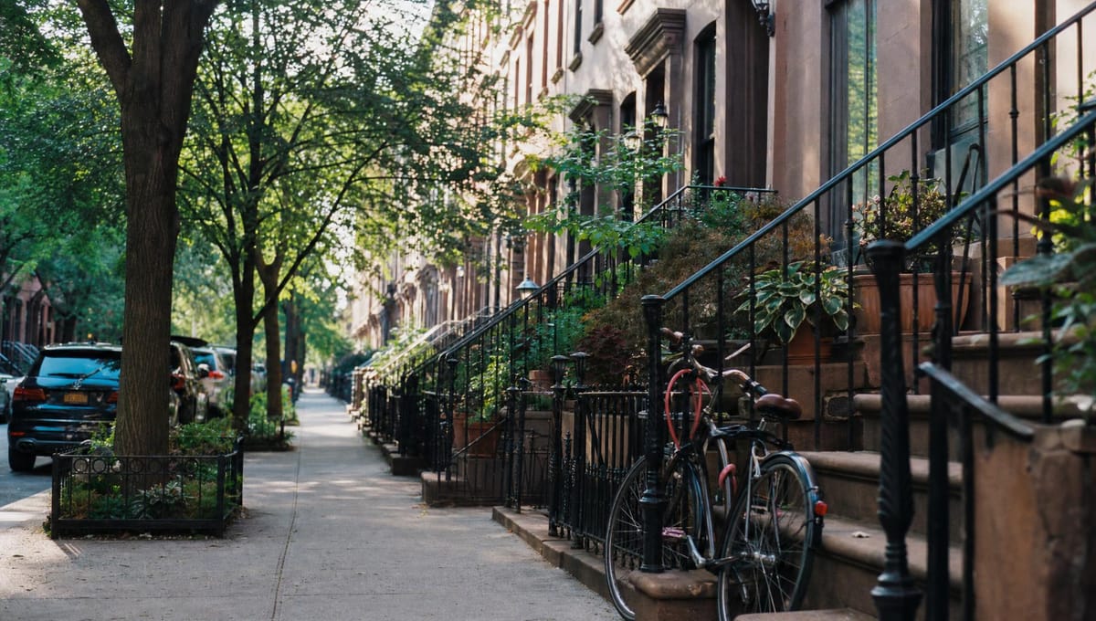 A tree-lined Brooklyn block of brownstone stoops
